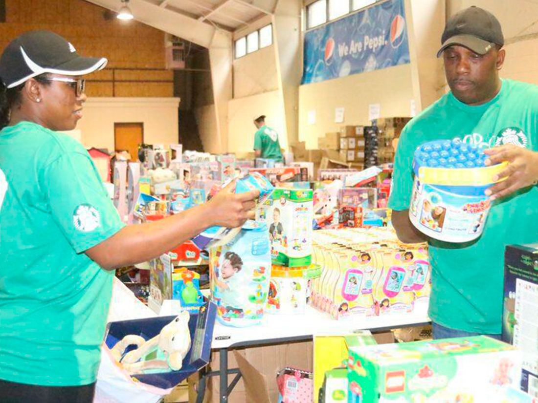volunteers-for-empty-stocking-fund-2 Amanda M. Usher | The Valdosta Daily TimesKishonna Nance, shift supervisor at Starbucks, and Travis Martin, store manager, volunteer for the Empty Stocking Fund toy giveaway